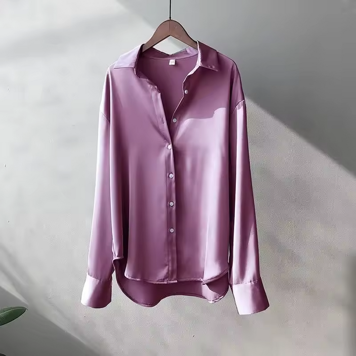 Women's fashion long sleeve button down blouse with relaxed elegant fit. Versatile top for modern style.