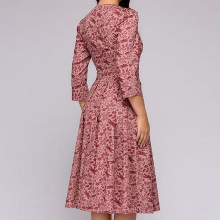 Chic floral A-line midi dress for women, 3/4 sleeves, embodying retro elegance & party style.