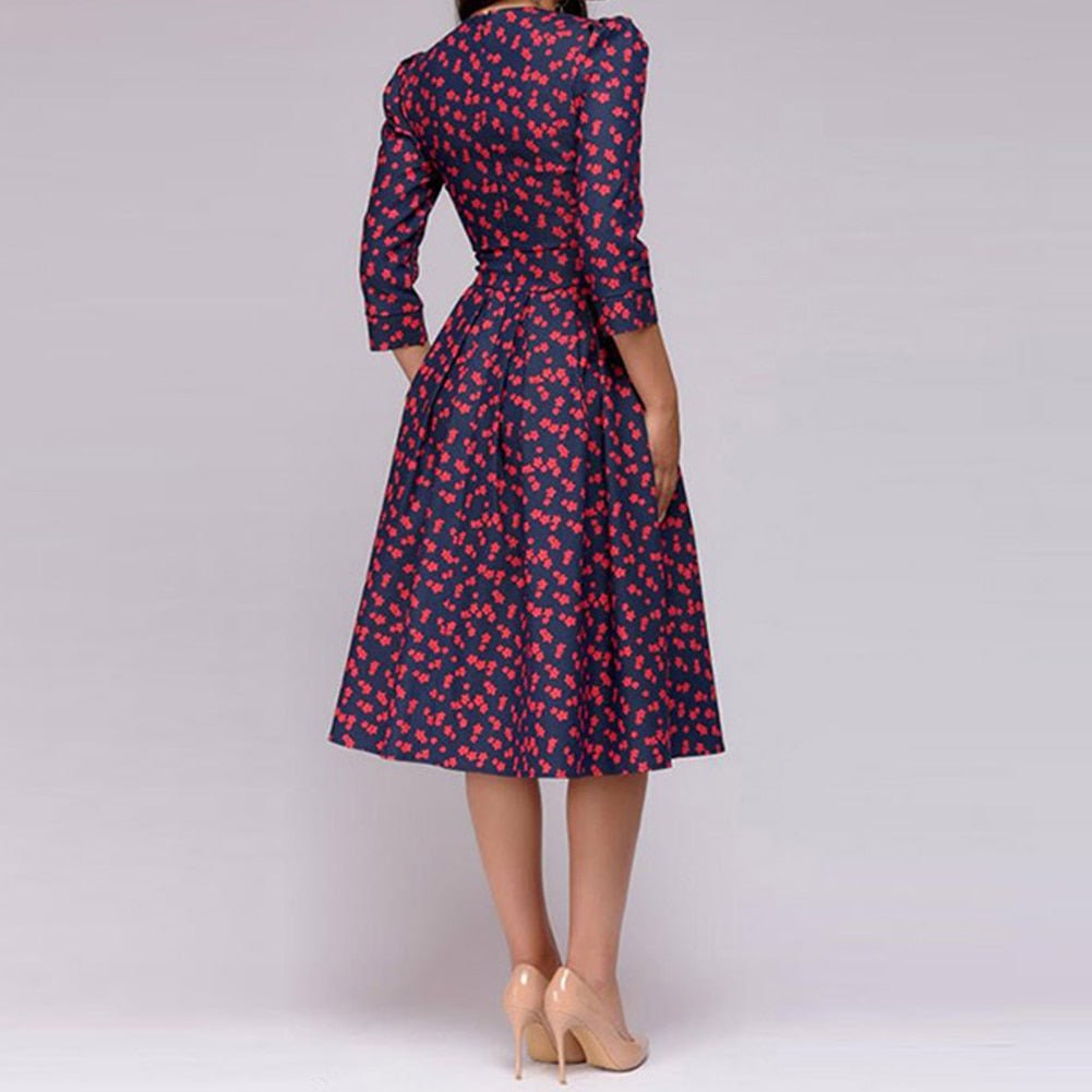 Close-up: Elegant women's retro A-line midi dress fabric detail, showcasing its classic 3/4 sleeve design.