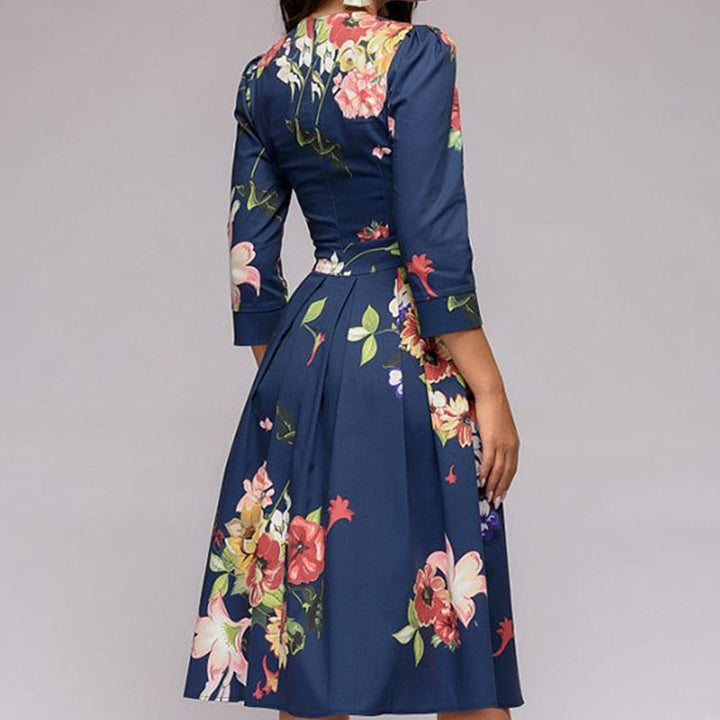 Model wears an elegant women's retro A-line midi dress, 3/4 sleeves, perfect for vintage-style parties.