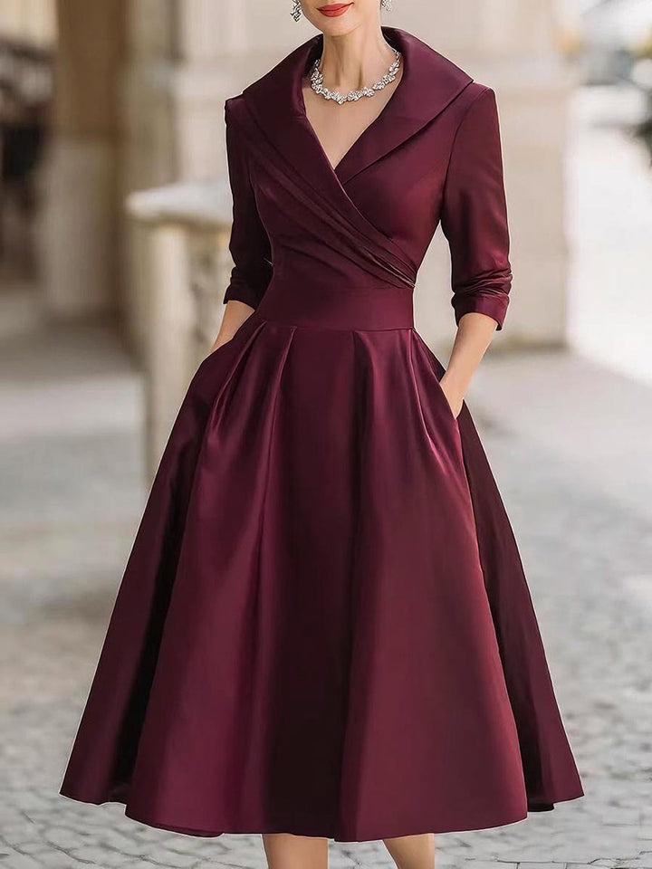 Stylish retro midi dress for women, featuring a beautiful draped collar and long sleeves.
