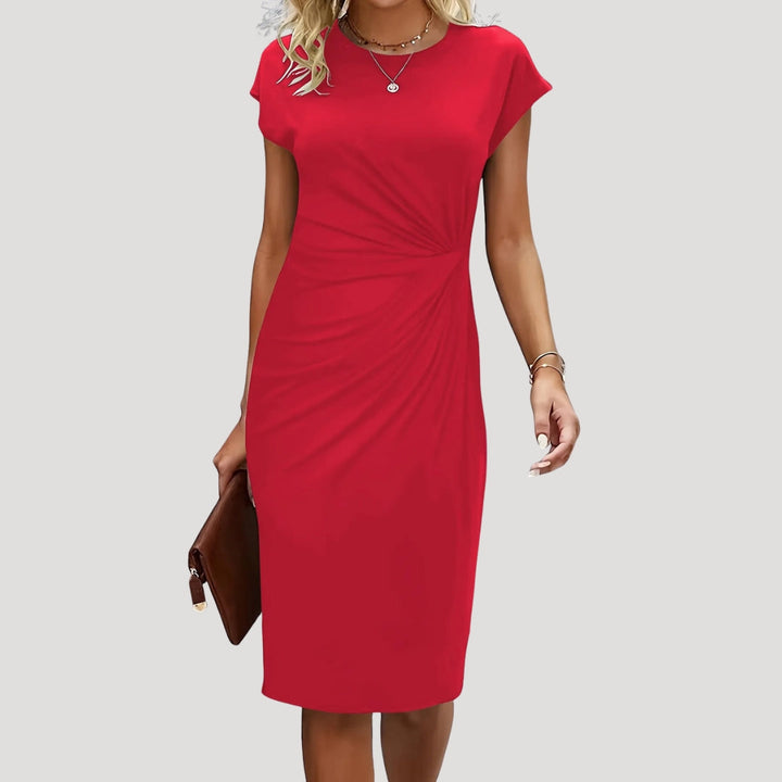 Fitted women's midi dress, elegant ruched design, cap sleeves, & round neck. Versatile for office or evening outfits.