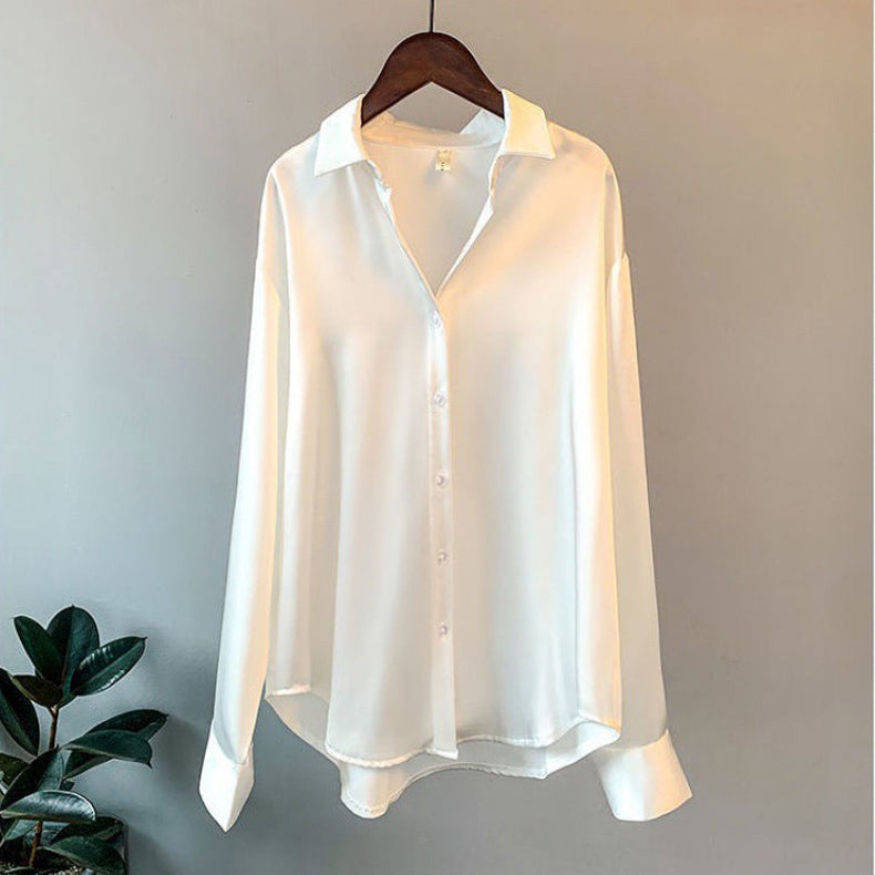 Elegant women's ruffle blouse with long sleeves, button-up front, and relaxed fit. Perfect for work or day-to-night.