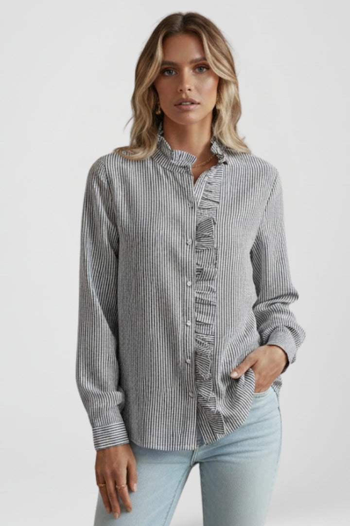 Versatile women's long sleeve ruffle blouse, an elegant button-up top suitable for professional or casual fashion.