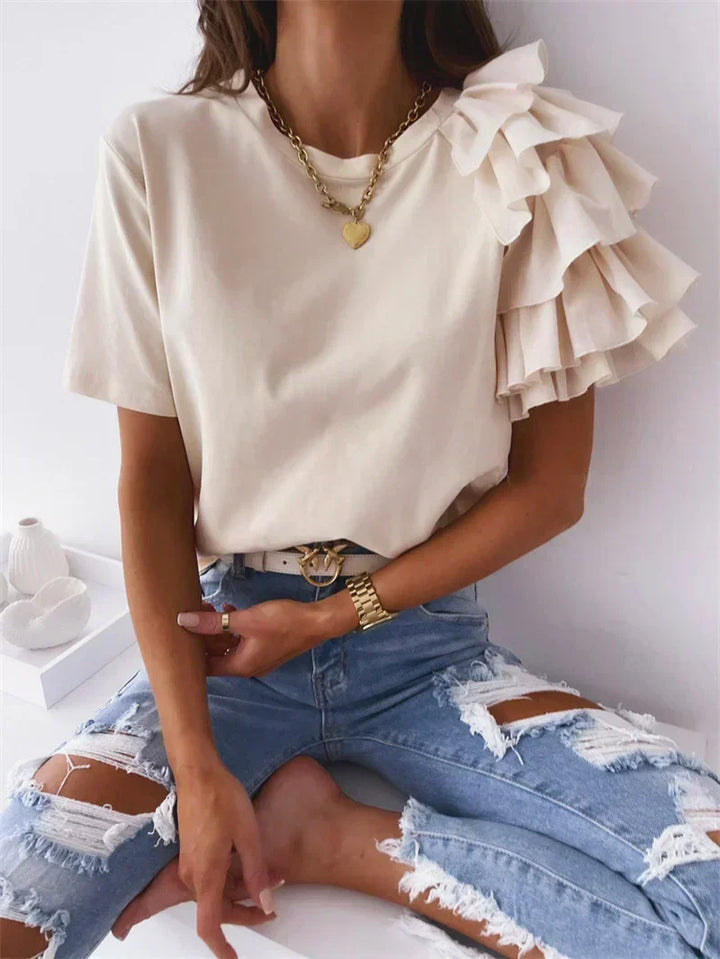 Stylish women's ruffle sleeve top, an elegant and versatile blouse for spring and summer fashion. Chic design.