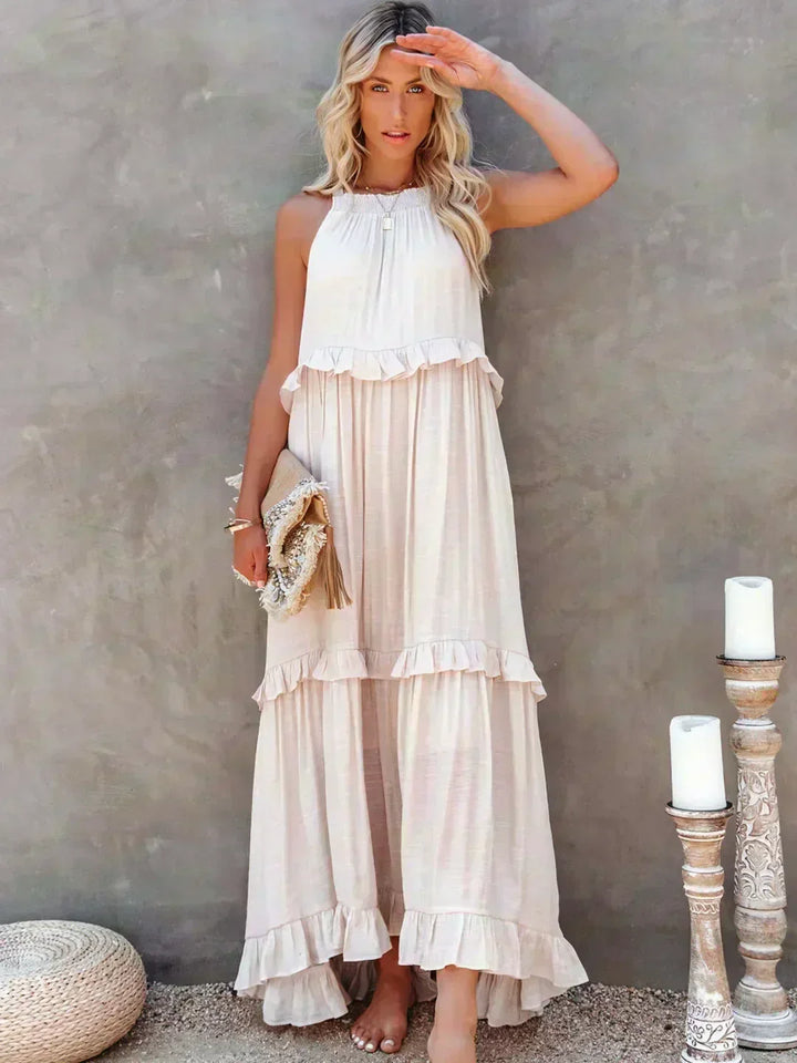 Elegant women's ruffled flowy sleeveless midi dress. Perfect for summer parties & vacations.