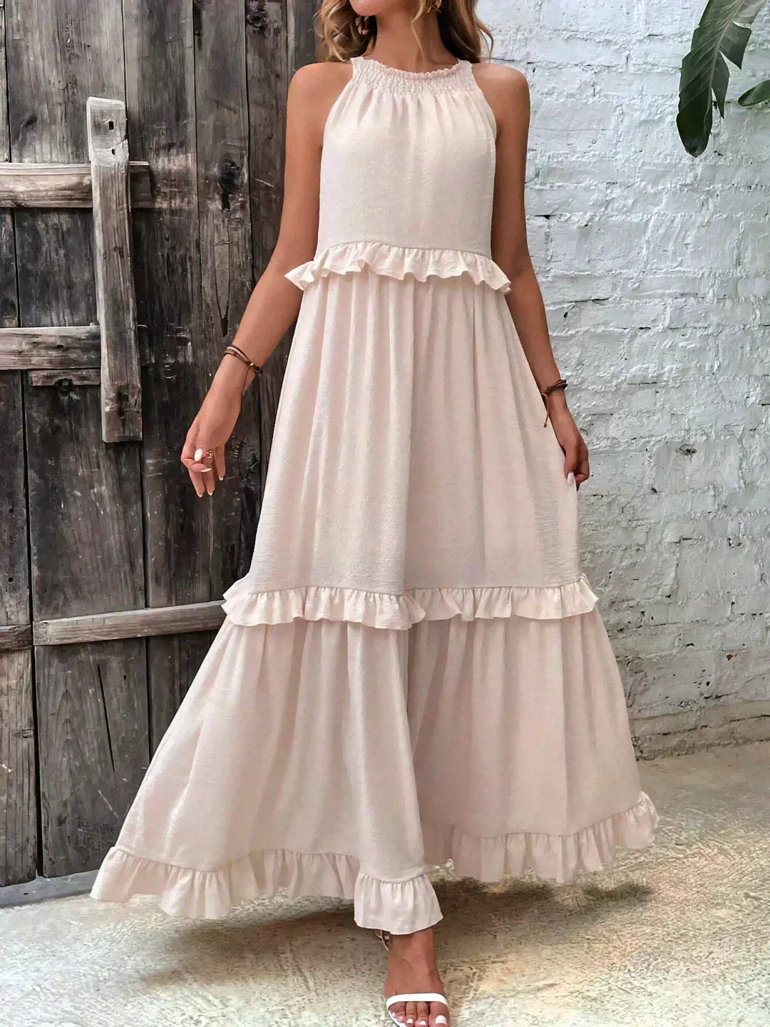 Feminine women's ruffled midi dress; a comfortable, flowy, and sleeveless option for summer.