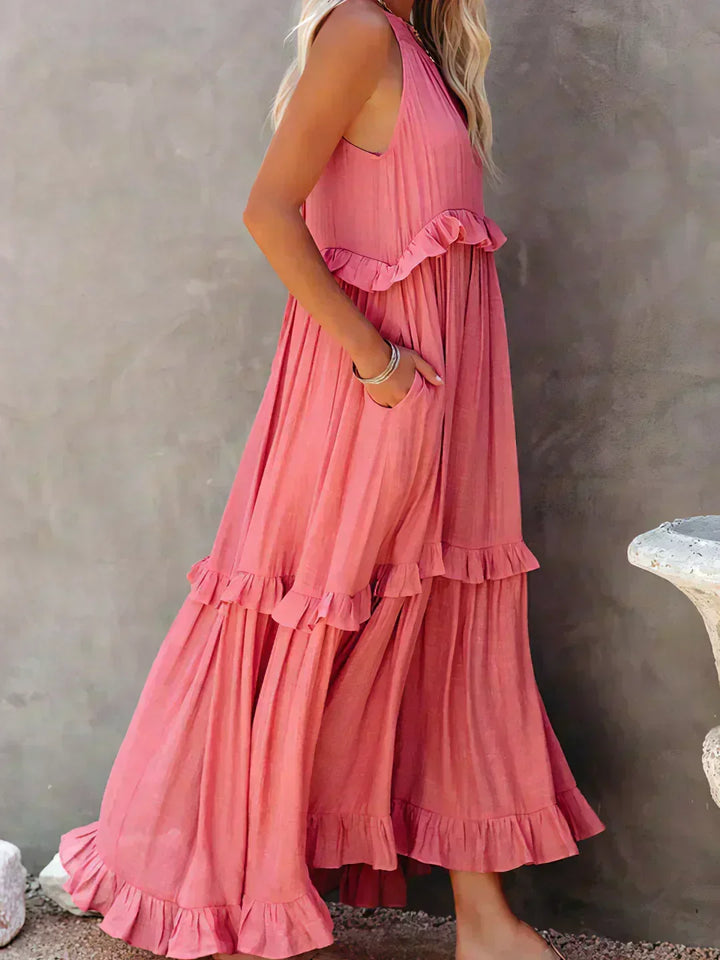 On-trend women's midi dress: sleeveless, flowy, ruffled, combining comfort with modern elegance.