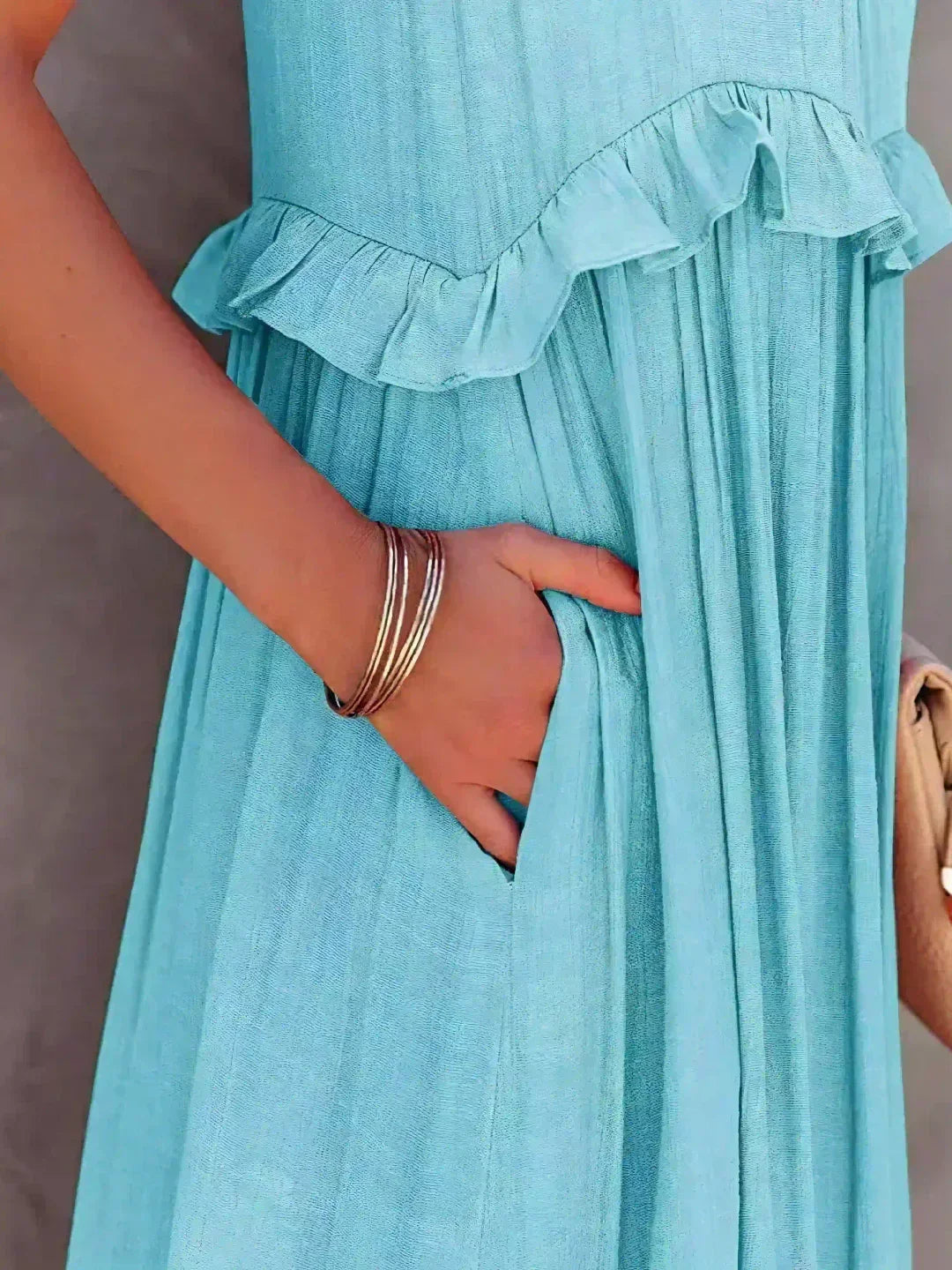 Graceful women's ruffled flowy sleeveless midi dress, perfect for garden parties or beach strolls.