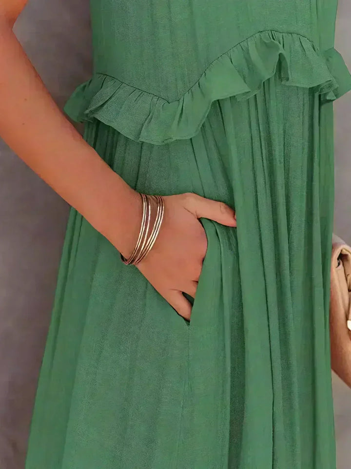 Feel fabulous in this women's elegant flowy midi dress, complete with ruffles & a sleeveless cut.