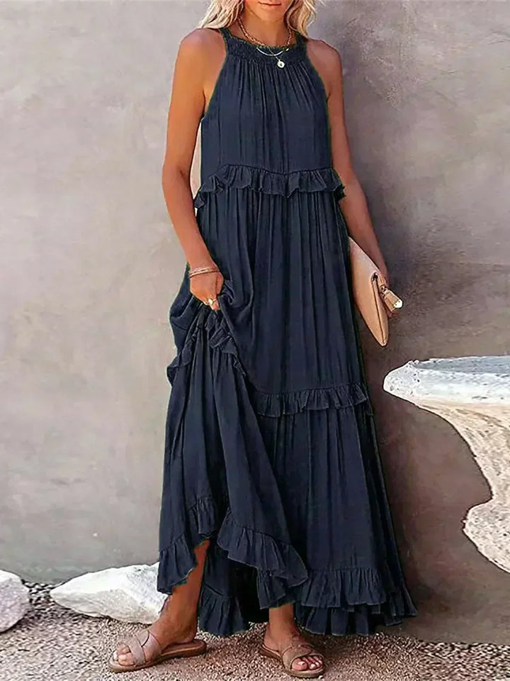 Stylish women's summer midi dress, featuring a flowy design, ruffles, and sleeveless comfort.
