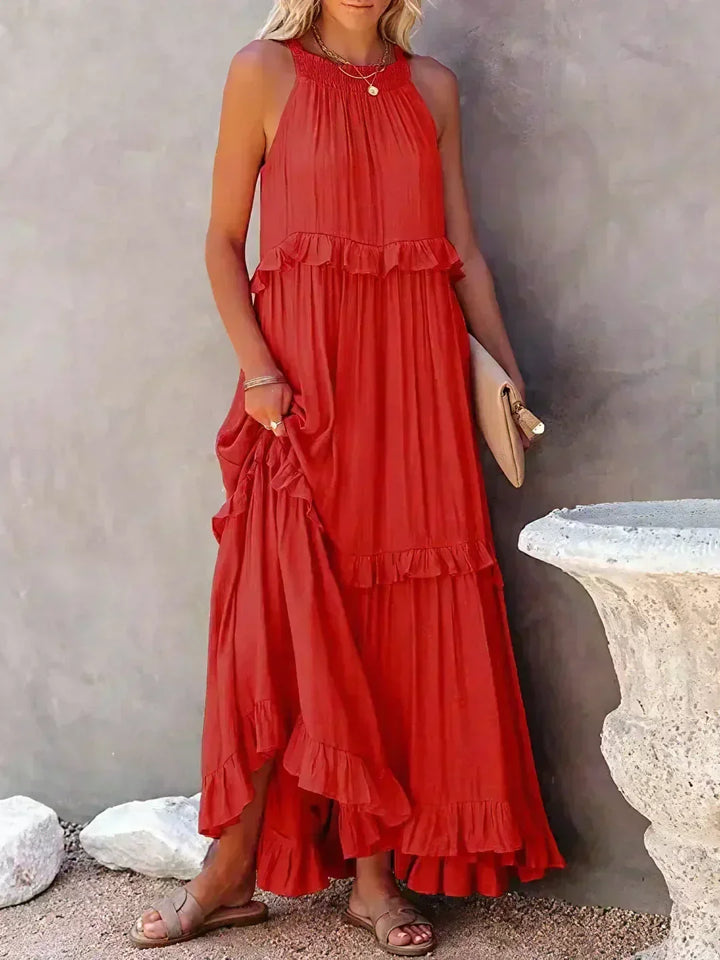 Vacation essential: women's flowy midi dress, sleeveless, ruffled, offering comfort & style.