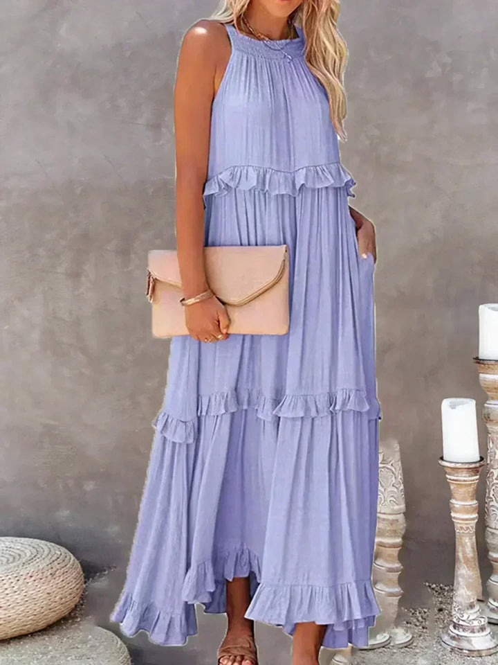 Light & airy women's sleeveless midi dress with a graceful ruffled and flowy design.