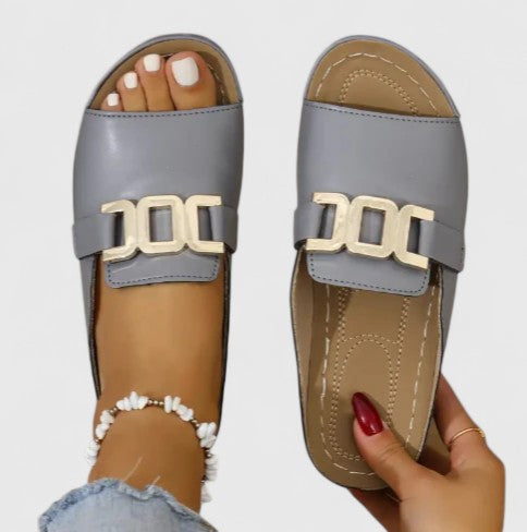 Elegant slip-on flat sandals for women, ensuring all-day comfort with advanced arch support.
