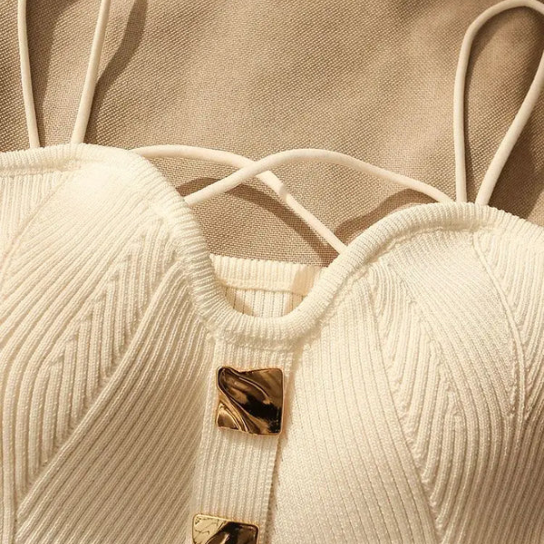 Fashionable women's sleeveless sculpted corset top, versatile with adjustable straps & chic gold hardware.