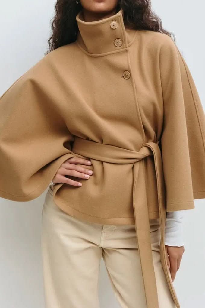 Chic women's self-tie cape, oversized & draped, offering versatile elegant outerwear for any season.