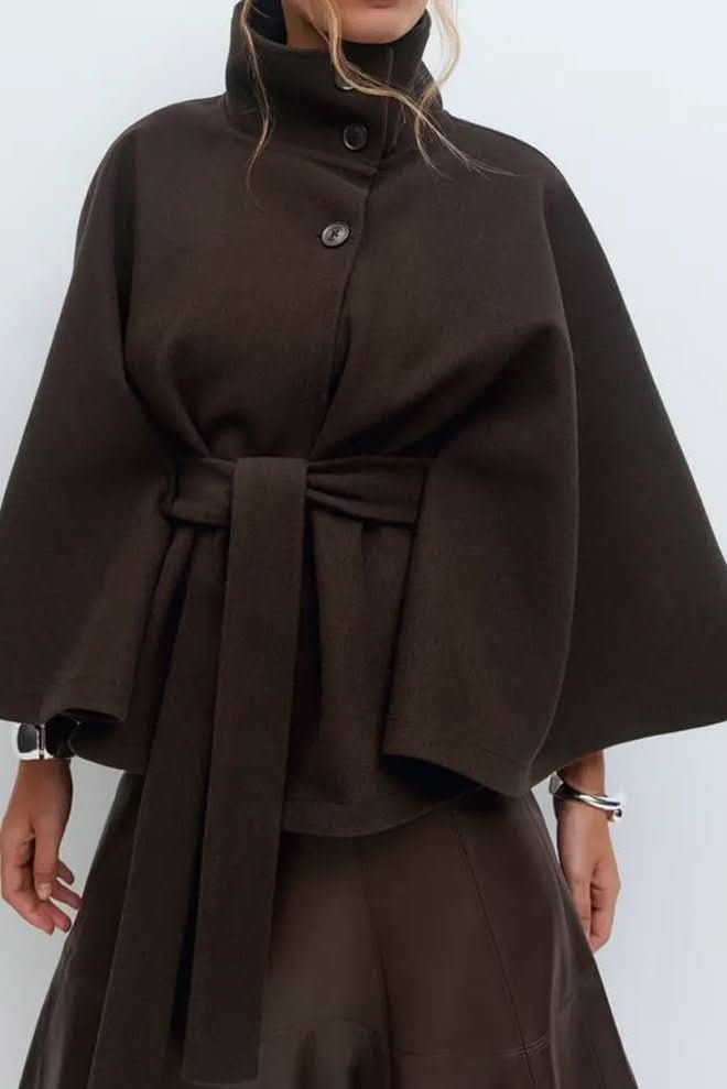 Luxurious women's self-tie cape, showcasing an oversized draped fit for versatile and chic layering.