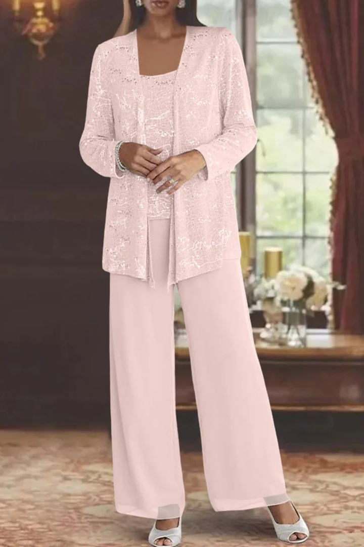 Dynamic pose in women's sequin three-piece pant set. Perfect formal evening wear with wide-leg pants & cardigan.