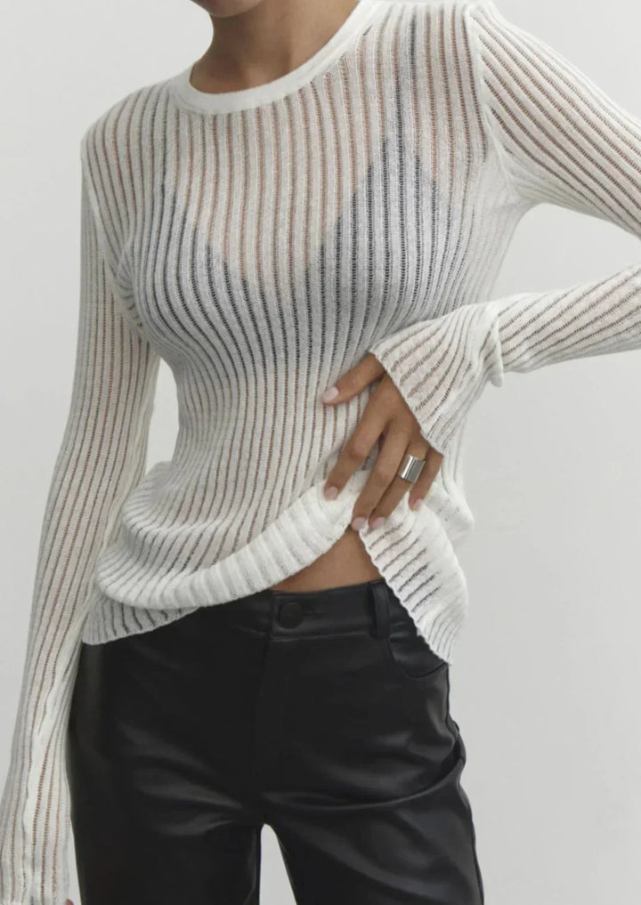Stylish women's sheer long sleeve ribbed top, ideal for day to night wear and fashion outfits.