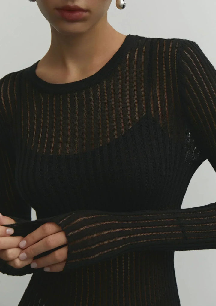 Versatile sheer ribbed women's long sleeve top, a fitted and elegant piece for any wardrobe.