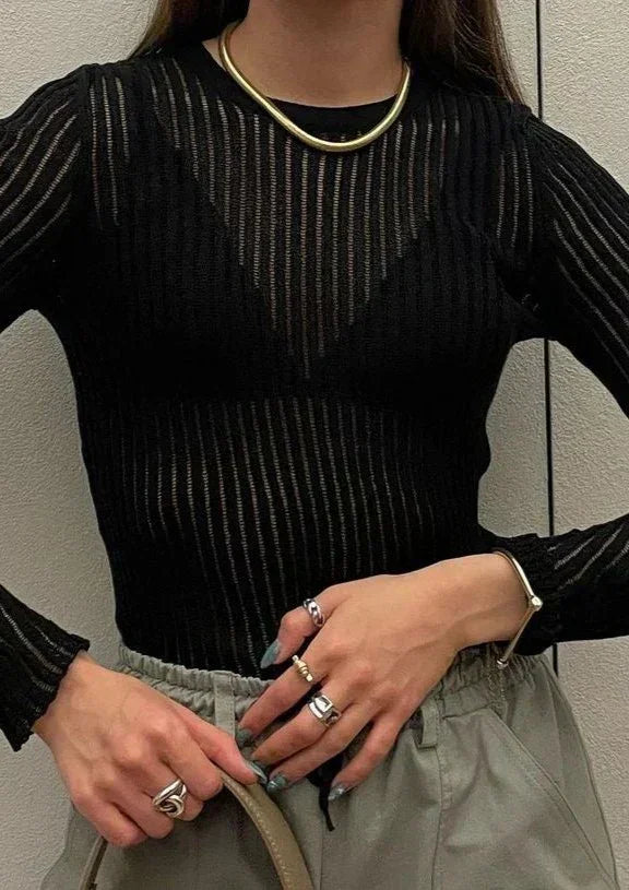 Fashionable women's long sleeve top with sheer ribbed fabric, offering a chic & modern look.