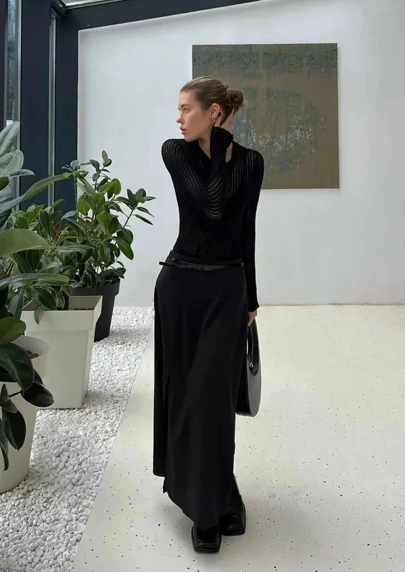 Soft, sheer ribbed women's long sleeve top, designed for a comfortable yet stylish fitted silhouette.