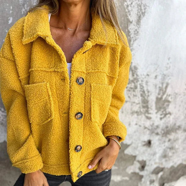 Elegant women's short lapel collar jacket in a chic design. Perfect for fall and winter fashion. Stylish outerwear.