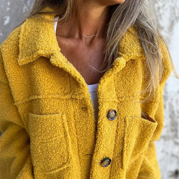 Stylish women's short jacket with lapel collar. Comfortable & versatile outerwear for casual or elegant fall/winter looks.
