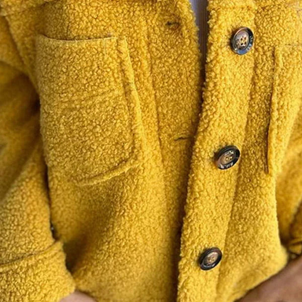 Chic women's lapel collar short jacket with button closure. Ideal fall/winter outerwear for a fashionable elegant look.