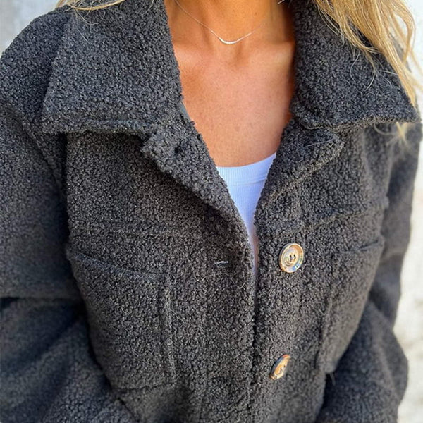 Elegant women's short jacket with classic lapel collar. Chic and comfortable outerwear for fall & winter fashion versatility.