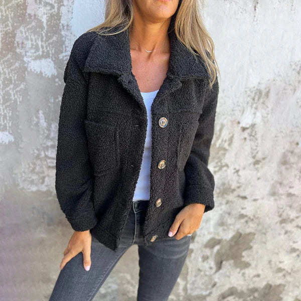 Women's chic short jacket with elegant lapel collar. A stylish, comfortable outerwear piece for fall and winter fashion.