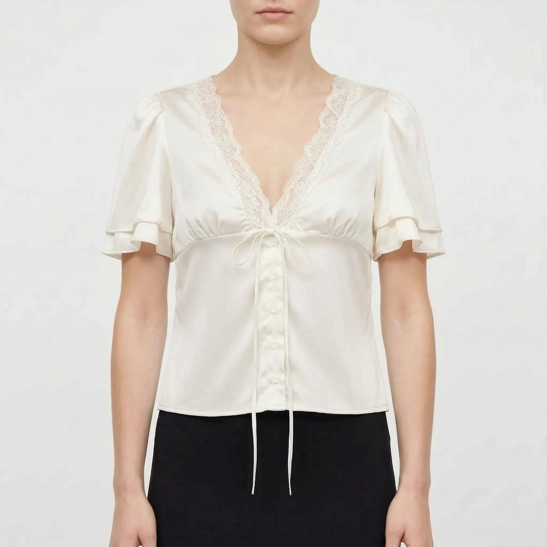 Comfortable women's V-neck blouse, short flutter sleeves, and elegant lace trim, great for casual or dressy looks.