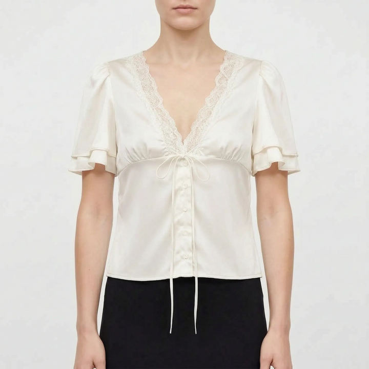 Comfortable women's V-neck blouse, short flutter sleeves, and elegant lace trim, great for casual or dressy looks.