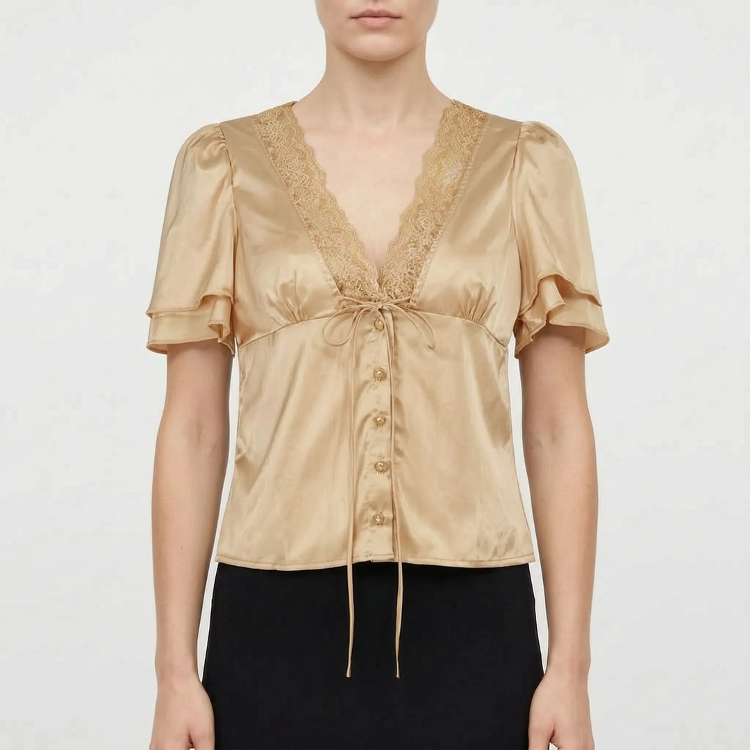 Chic women's short sleeve top with delicate lace trim, V-neck, perfect for versatile day-to-night summer fashion.