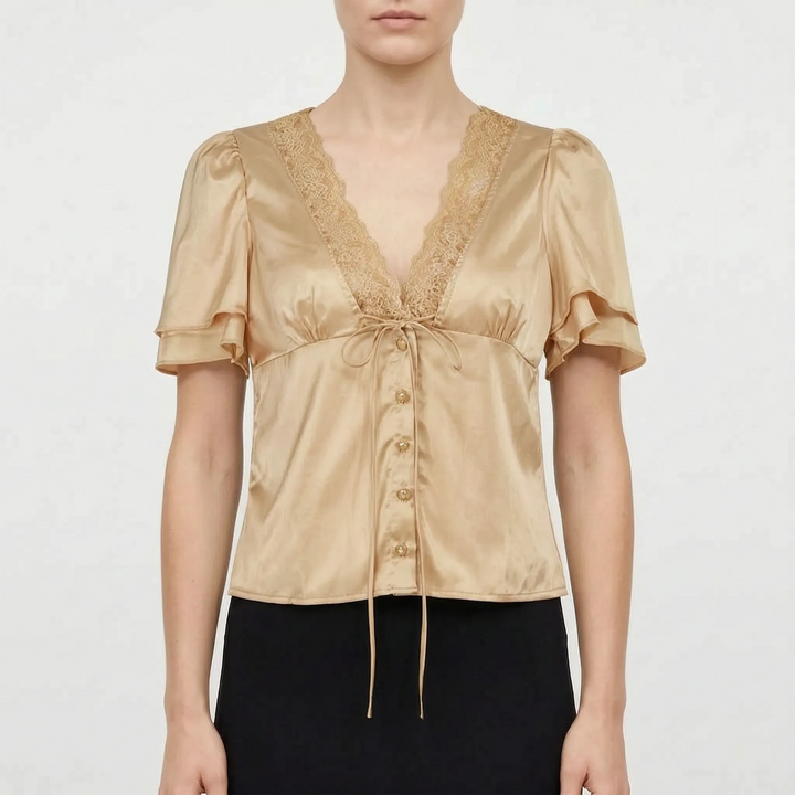 Chic women's short sleeve top with delicate lace trim, V-neck, perfect for versatile day-to-night summer fashion.