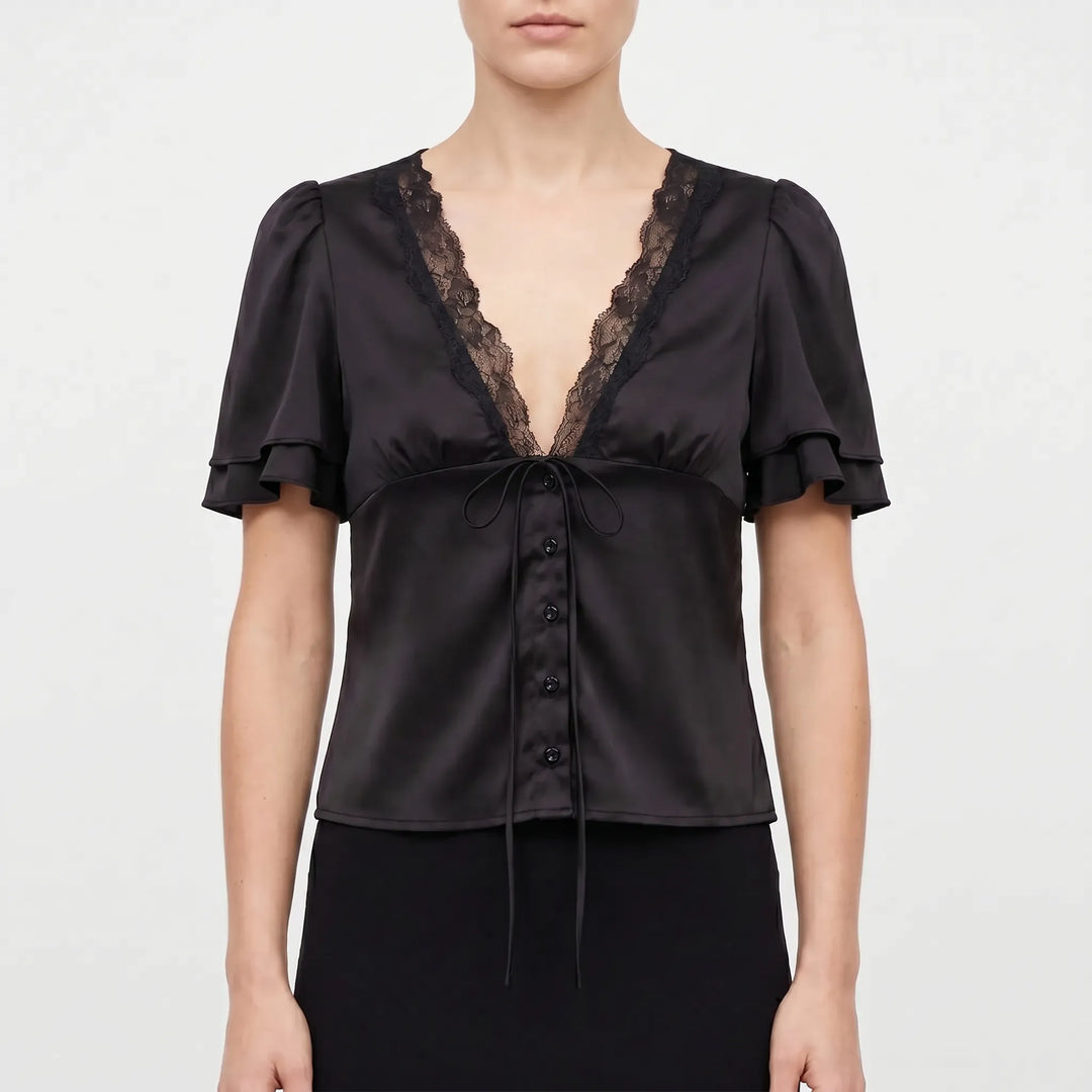 Elegant women's blouse with delicate lace trim, short flutter sleeves, and a flattering V-neck for versatile styling.