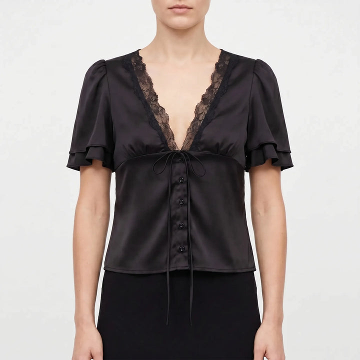 Elegant women's blouse with delicate lace trim, short flutter sleeves, and a flattering V-neck for versatile styling.