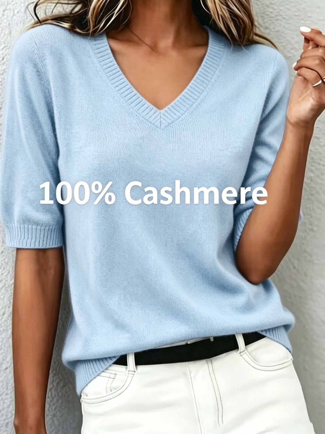 Soft women's short-sleeve V-neck sweater with a ribbed collar, offering a comfortable, flattering fit.