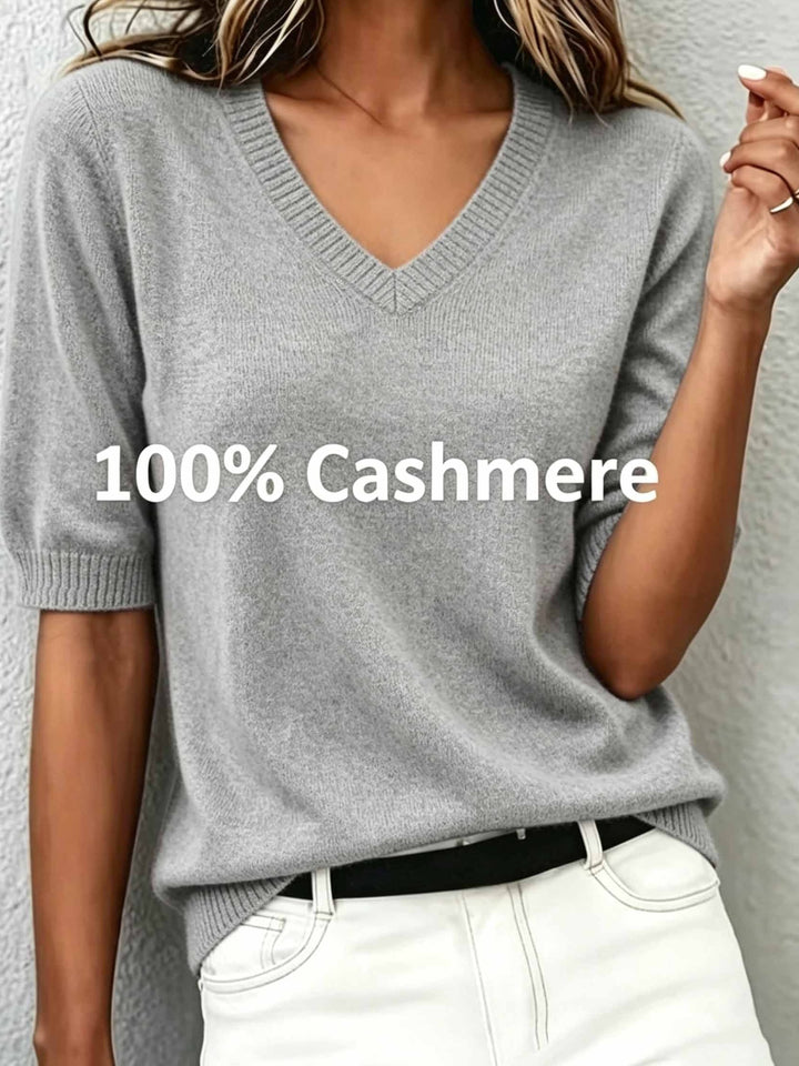 Women's short-sleeve V-neck sweater with a refined ribbed collar, suitable for office & casual wear.
