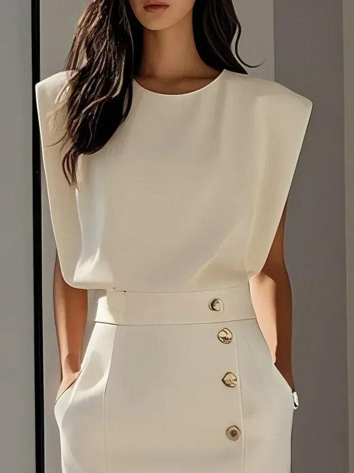Chic sleeveless midi dress for women, perfect for events, with a stylish slit & elegant gold buttons.