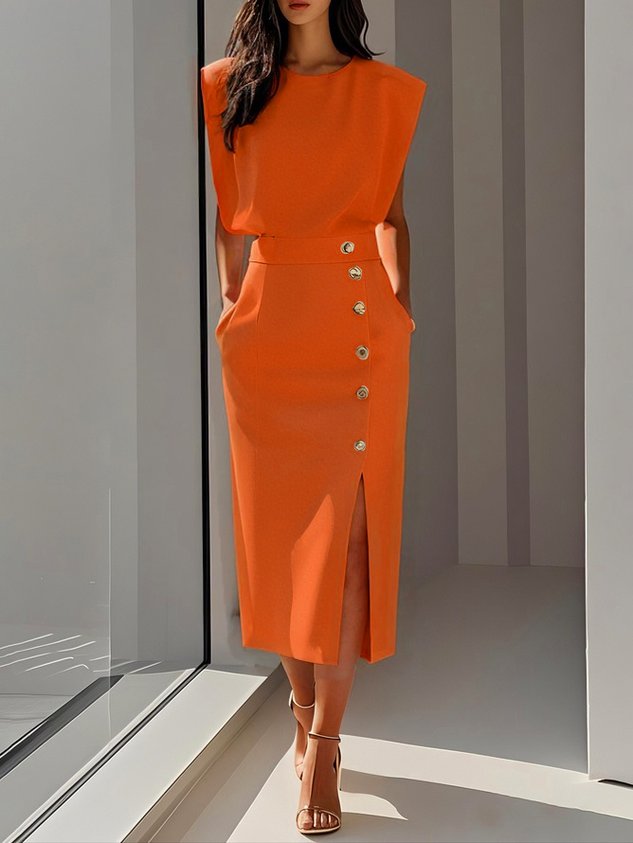 Sophisticated women's office wear midi dress, sleeveless, with a modern slit & decorative gold buttons.