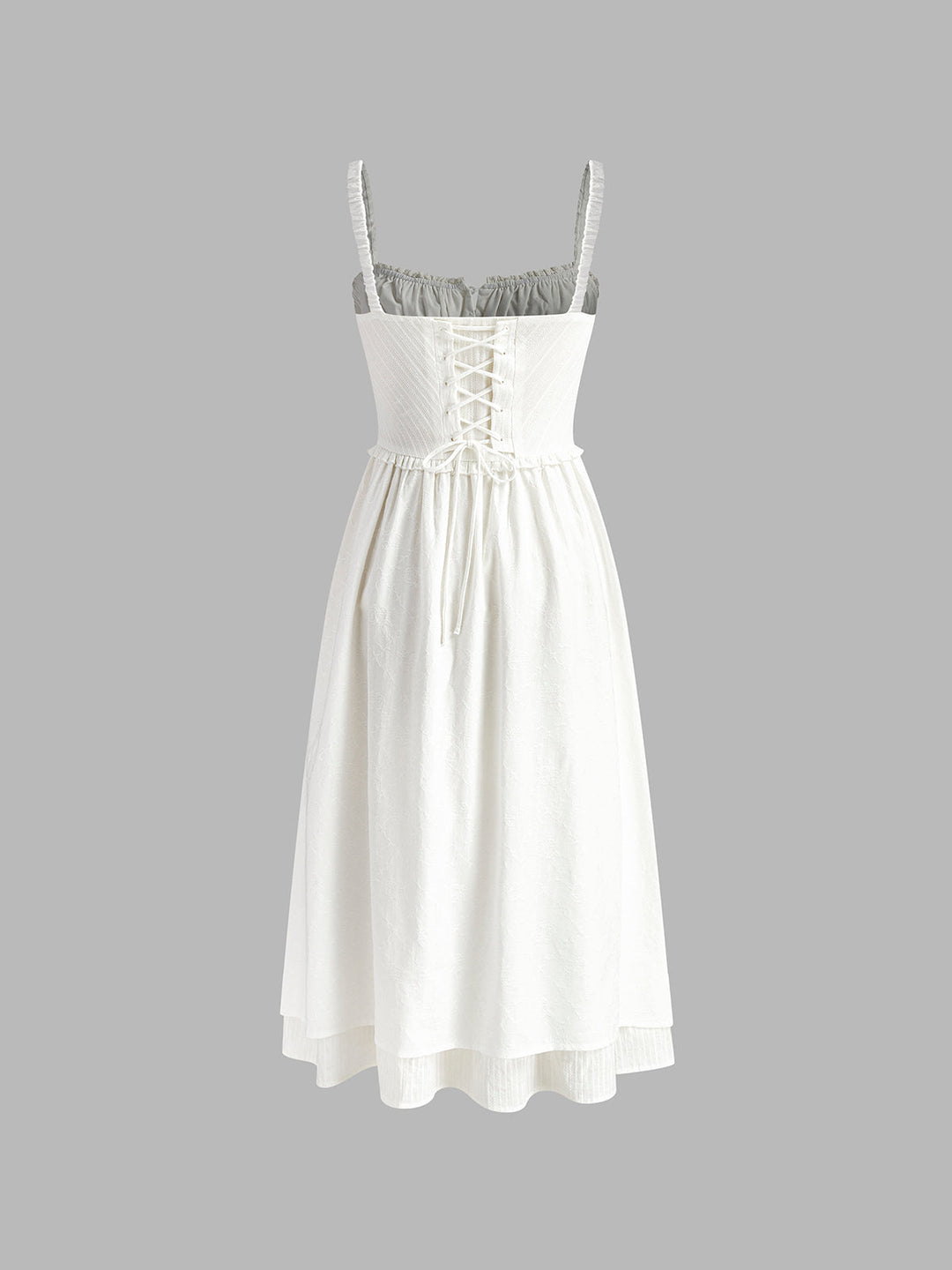 Women's solid color sleeveless midi dress. Elegant design with a beautiful ruffle hem, ideal for spring fashion.
