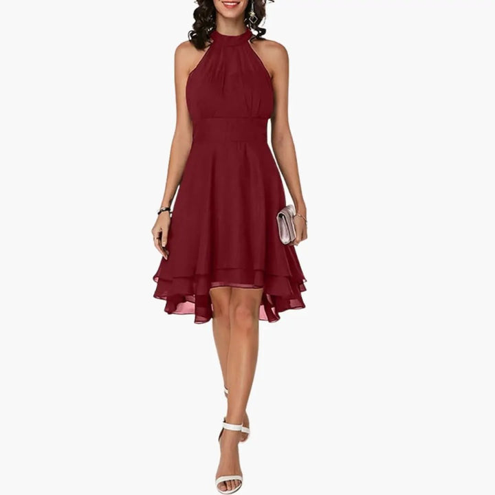 Sophisticated women's round neck sleeveless dress with delicate ruffles, knee-length for an elegant look.