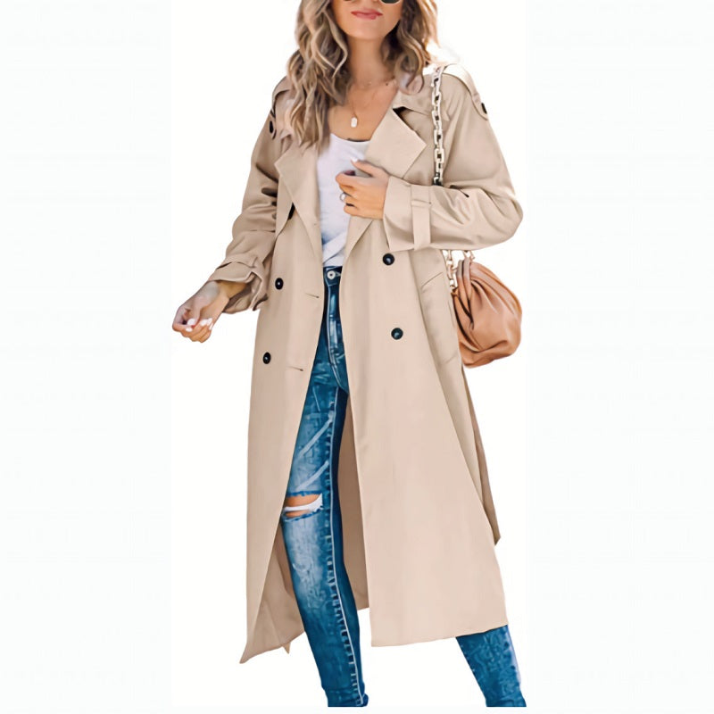 Women's slim fit trenchcoat from behind, highlighting elegant silhouette & classic style for formal wear.