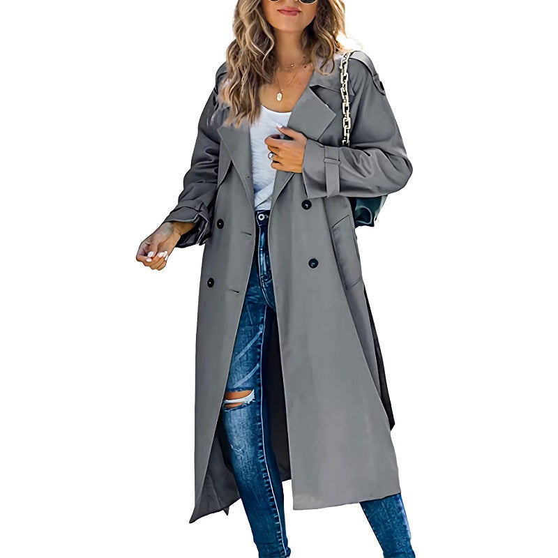 Woman wearing a versatile slim fit trenchcoat, styled for a chic casual yet formal look. Perfect outerwear.