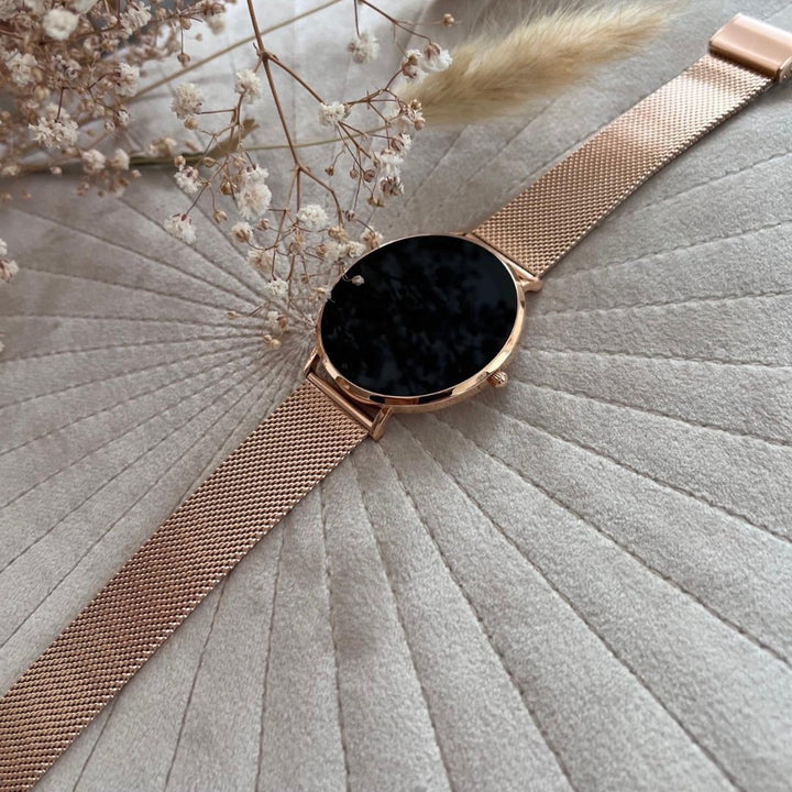 Silver women's smart watch with a sleek stainless steel design, ideal for activity and health tracking.