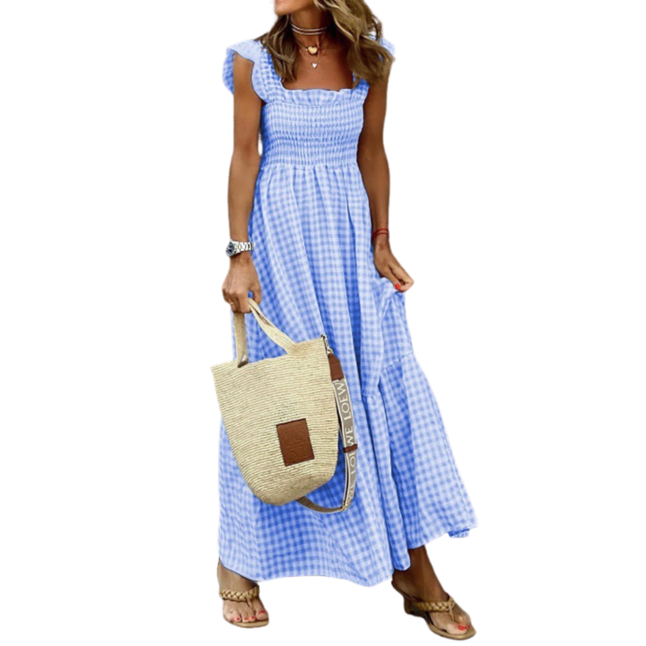 Stylish women's tiered maxi dress, smocked bodice, and flowy skirt. Perfect for spring & summer fashion.