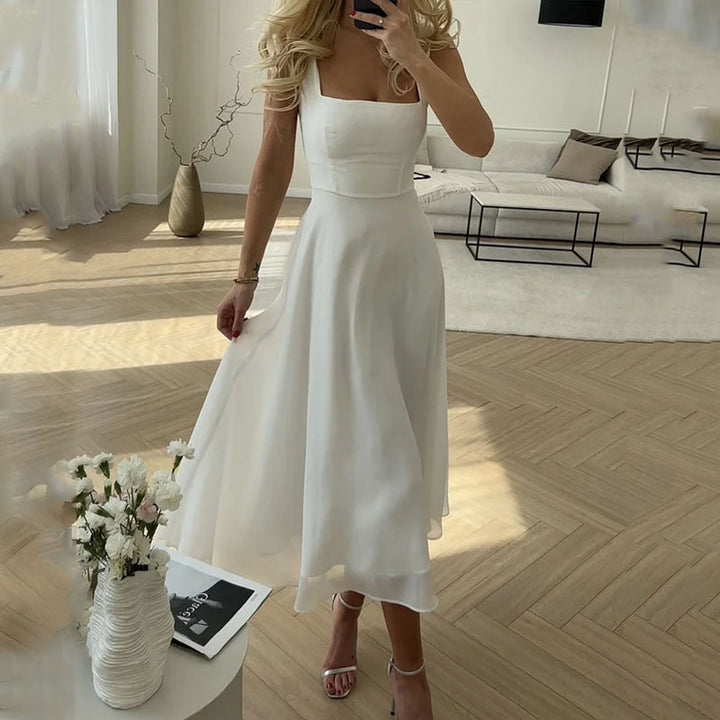 Stylish sleeveless midi dress with a square neck for women. Ideal for parties, special occasions, and elegant events.