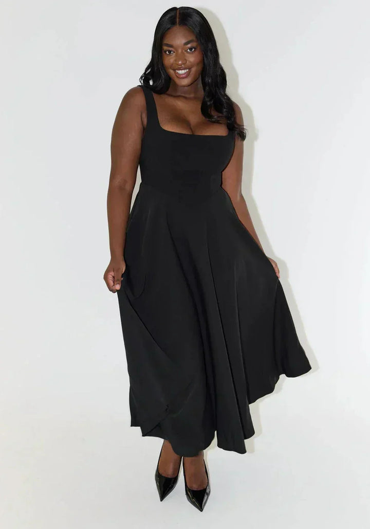 Back view of the women's elegant square neck midi dress, showing a flattering and comfortable fit.