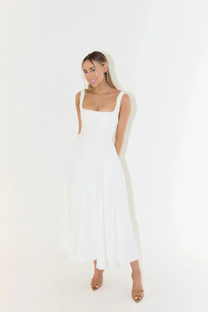 Elegant square neck midi dress worn outdoors, showcasing its versatile and timeless style for summer fashion.